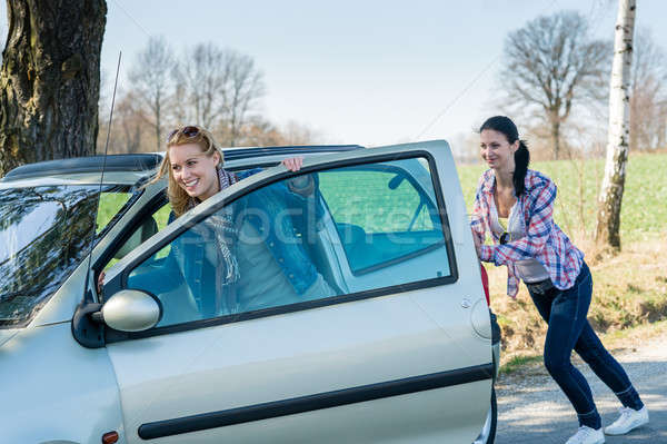 1879086_stock-photo-pushing-car-technical-failure-two-young-women.jpg